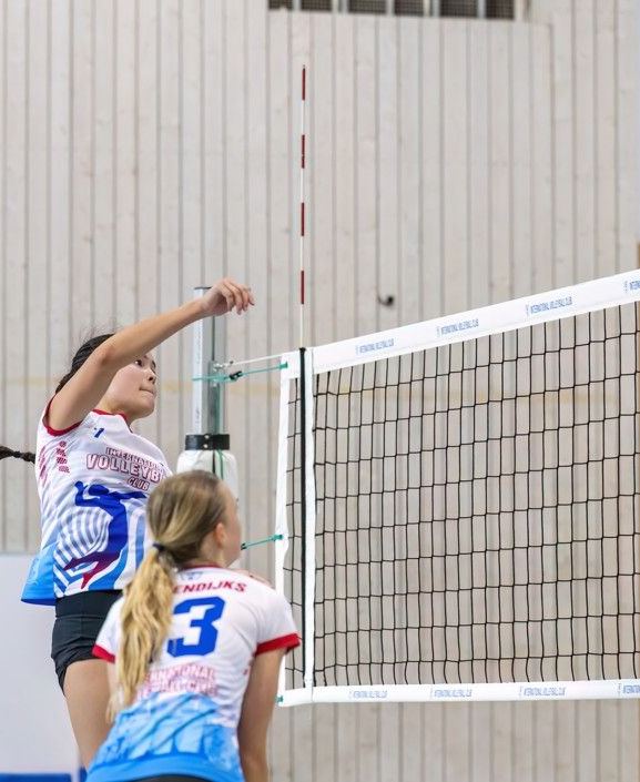 Youth volleyball match at the net